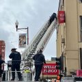 Wells Fargo sign blows loose; firefighters on scene