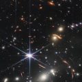 Scientists Puzzled by Hundreds of Little Red Dots in James Webb Images of Distant Universe