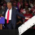 Trump, after mocking Harris over teleprompter use, stops rally to remove sign that fell on his